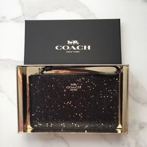 Coach black star & glitter wristlet